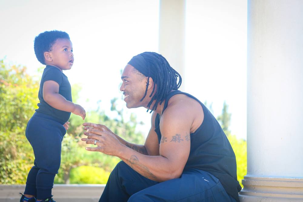 Father and toddler connecting