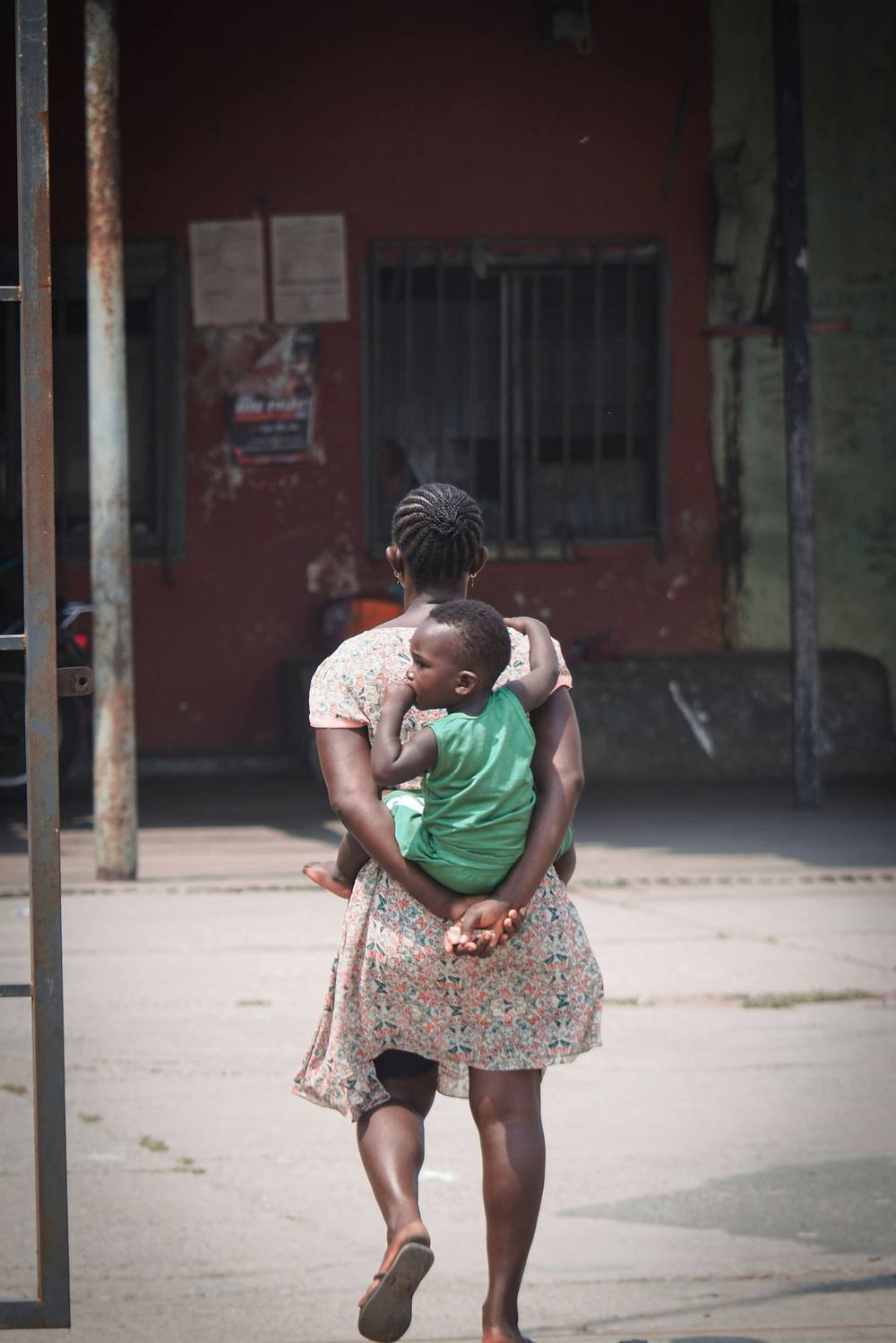 Mother carrying child